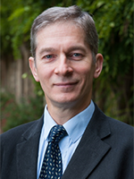 Head and shoulders shot of Robert in a suit