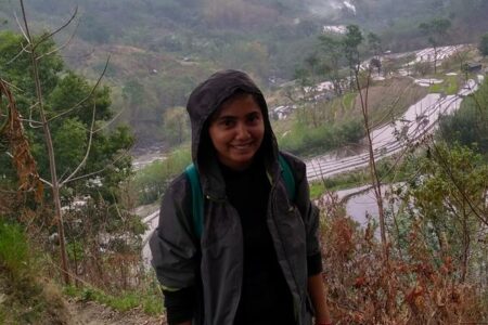 woman standing on mountainside