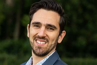 Brian against a black background