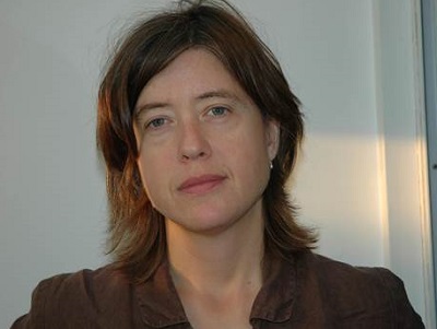 woman with brown shoulder length hair looking at the camera