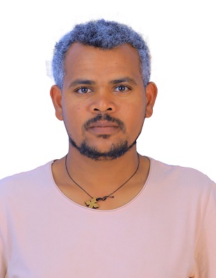 Man with necklance and white top looking at the camera